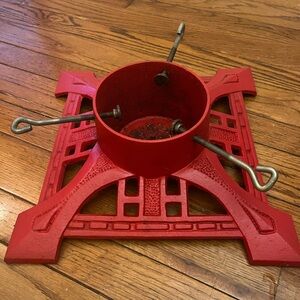 Heavy Christmas tree stand for tree 6’ and up. Made with cast iron. Red